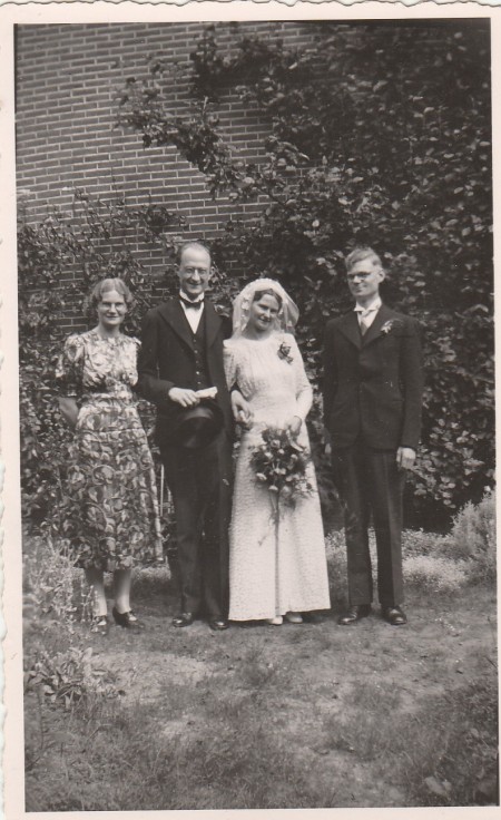 wedding photo of my parents with mum's brother and sister.
